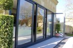 Indifold doors, demonstrating their sliding and folding mechanism, providing adaptable space usage and modern aesthetics