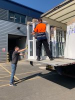 Delivery lorry unloading a fresh batch of sliding sash windows